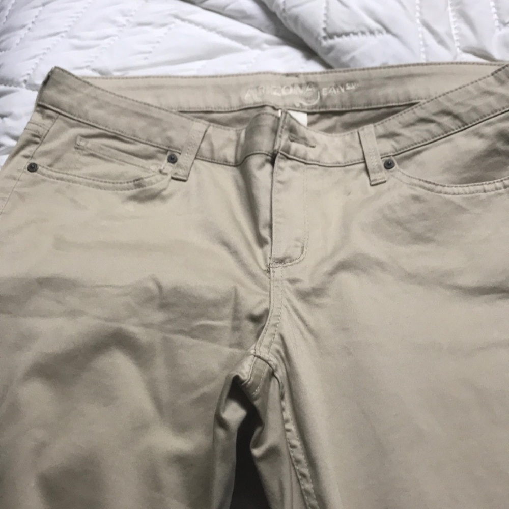 skinny legged khaki pants.